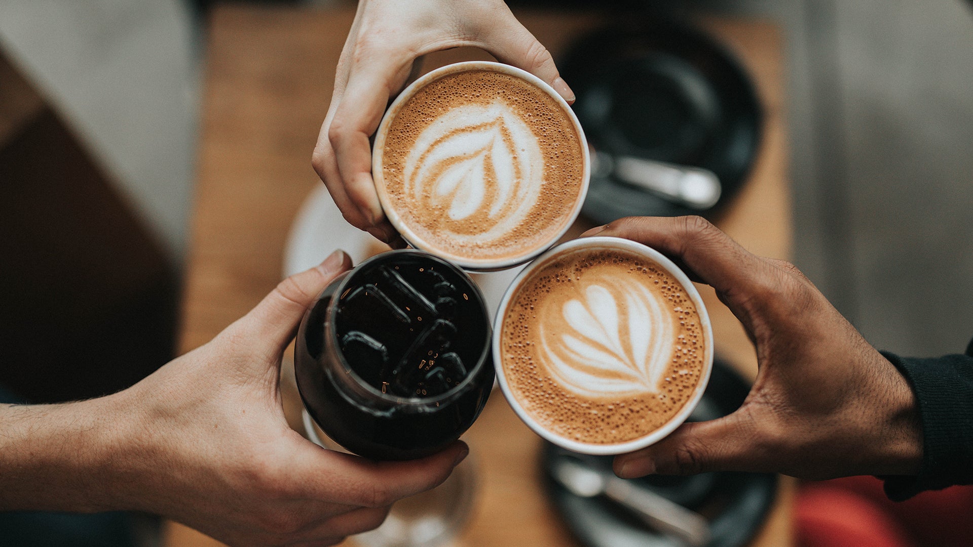 A Cheesing a coffee with friends